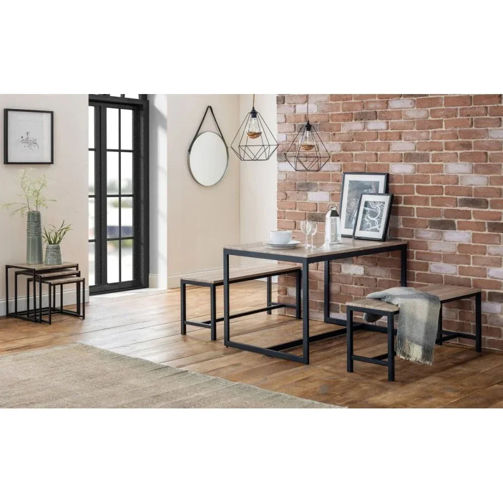 Industrial dining table set with black metal benches in modern loft room