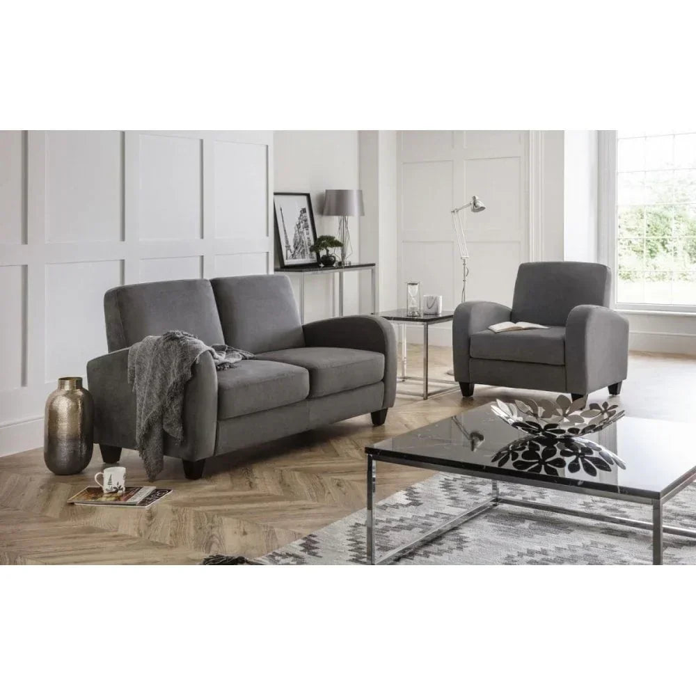 Grey fabric sofa and armchair set in contemporary living room with glass coffee table