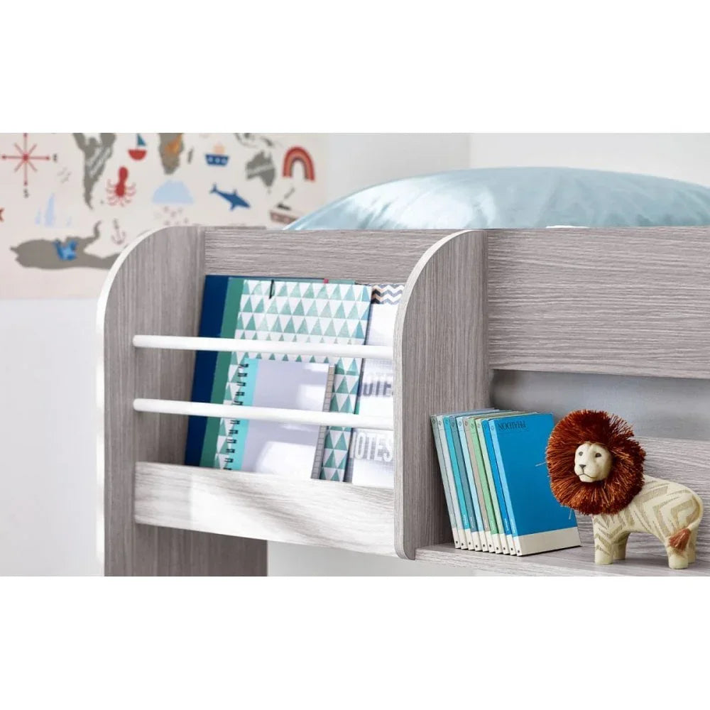 Grey wooden mid sleeper bed shelf with books, notebooks and small lion toy