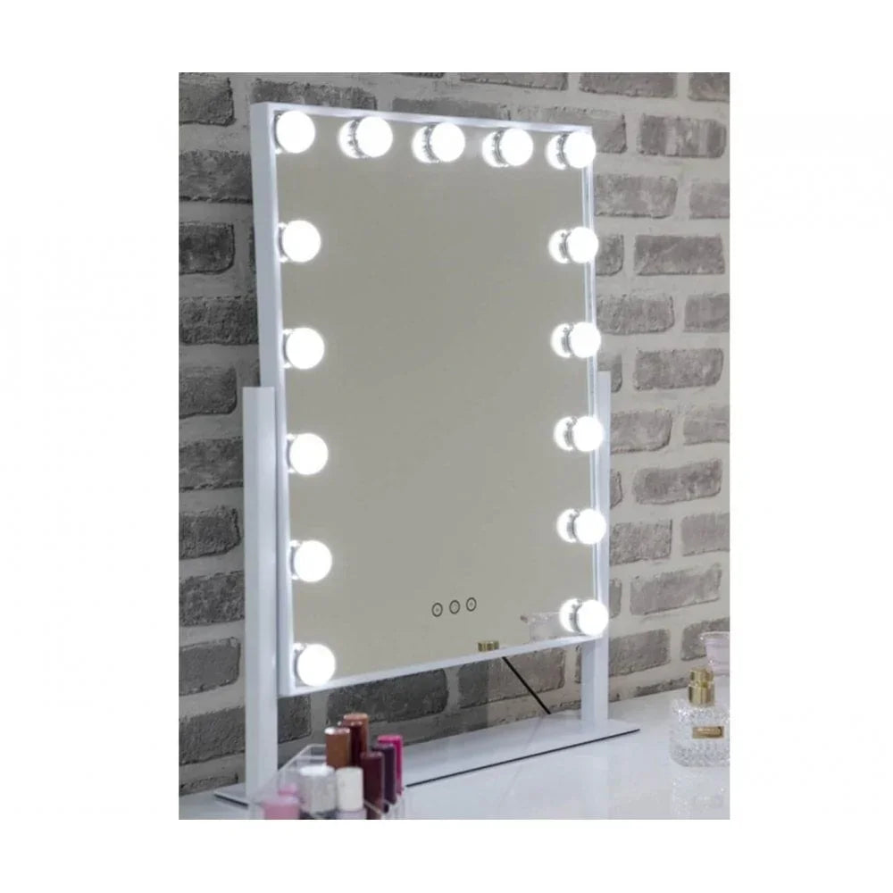 LED Hollywood mirror with white frame on dressing table against brick wall