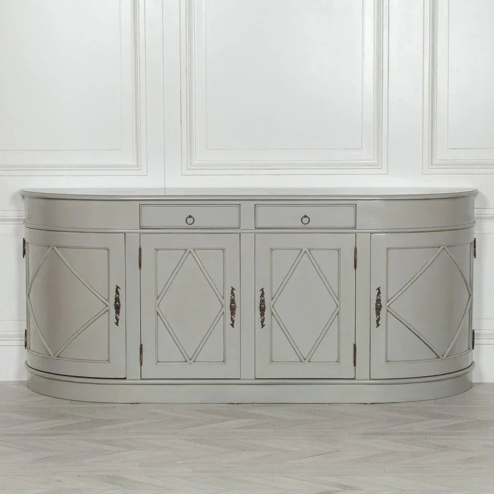 Grey sideboard cabinet with diamond panel doors, brass handles, and curved edges