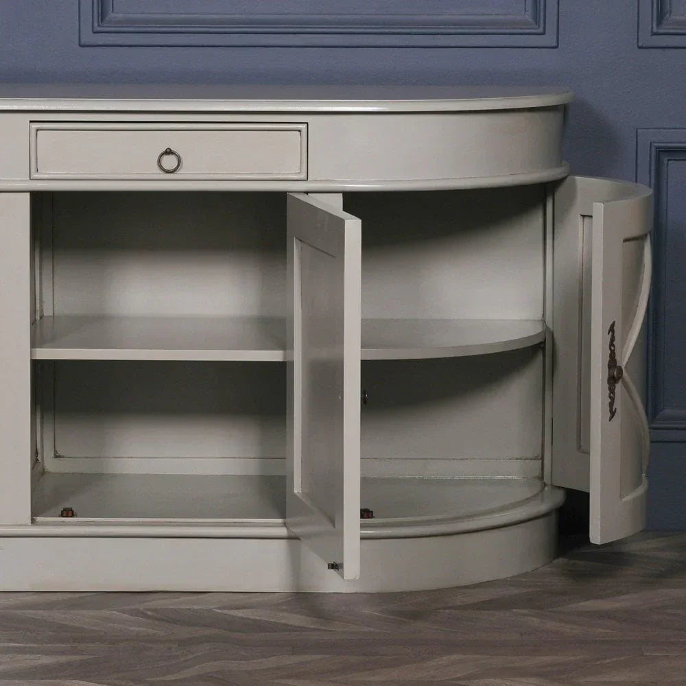 Grey wooden sideboard with rounded edges, open storage shelves, and drawer detail