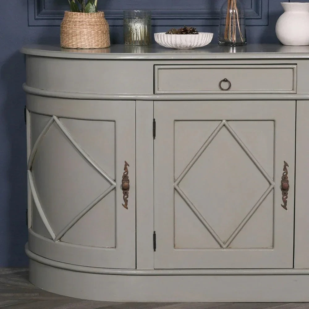 Grey wooden sideboard with diamond pattern doors and bronze handles, styled with decor