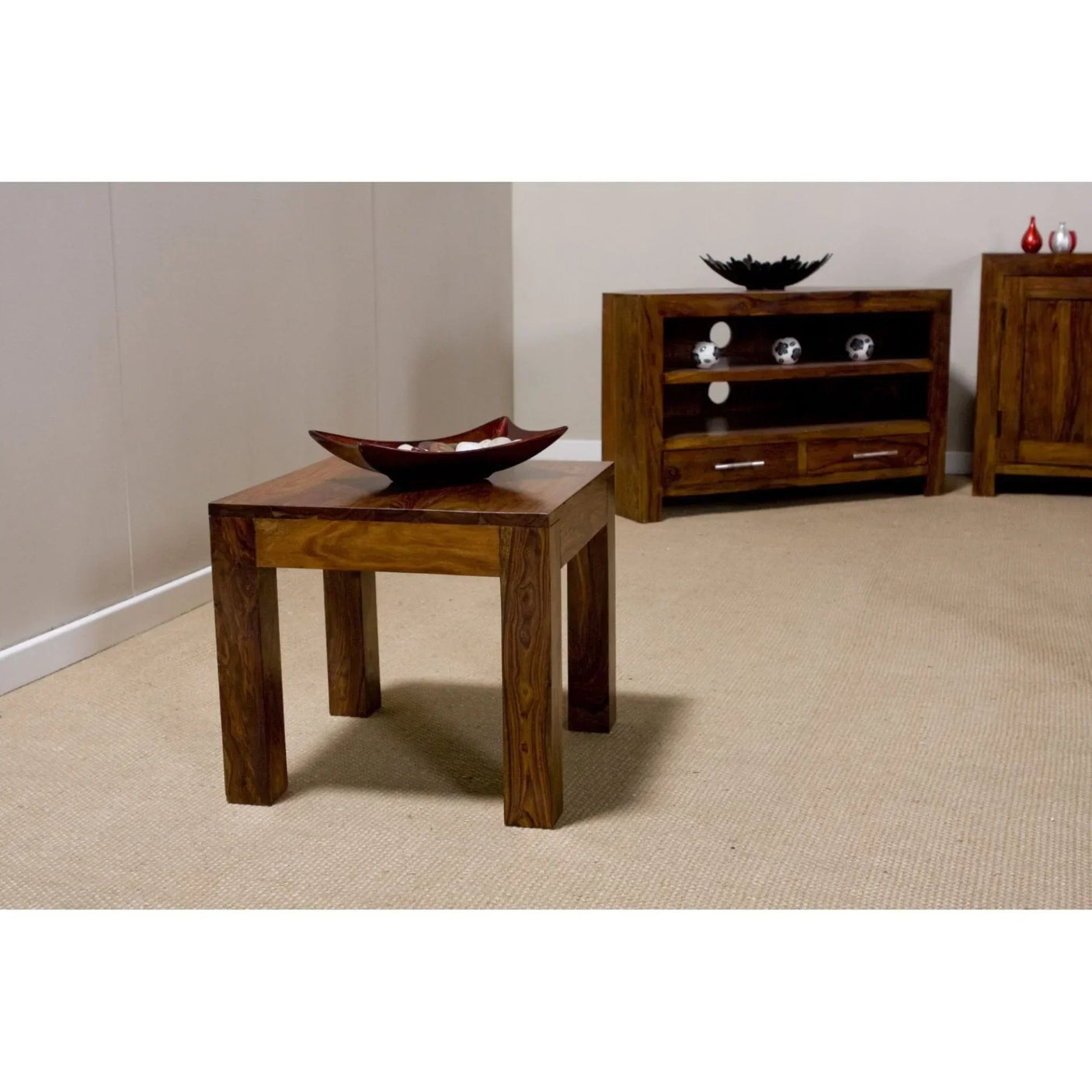 Solid wood side table with square legs and decorative bowl in living room setting