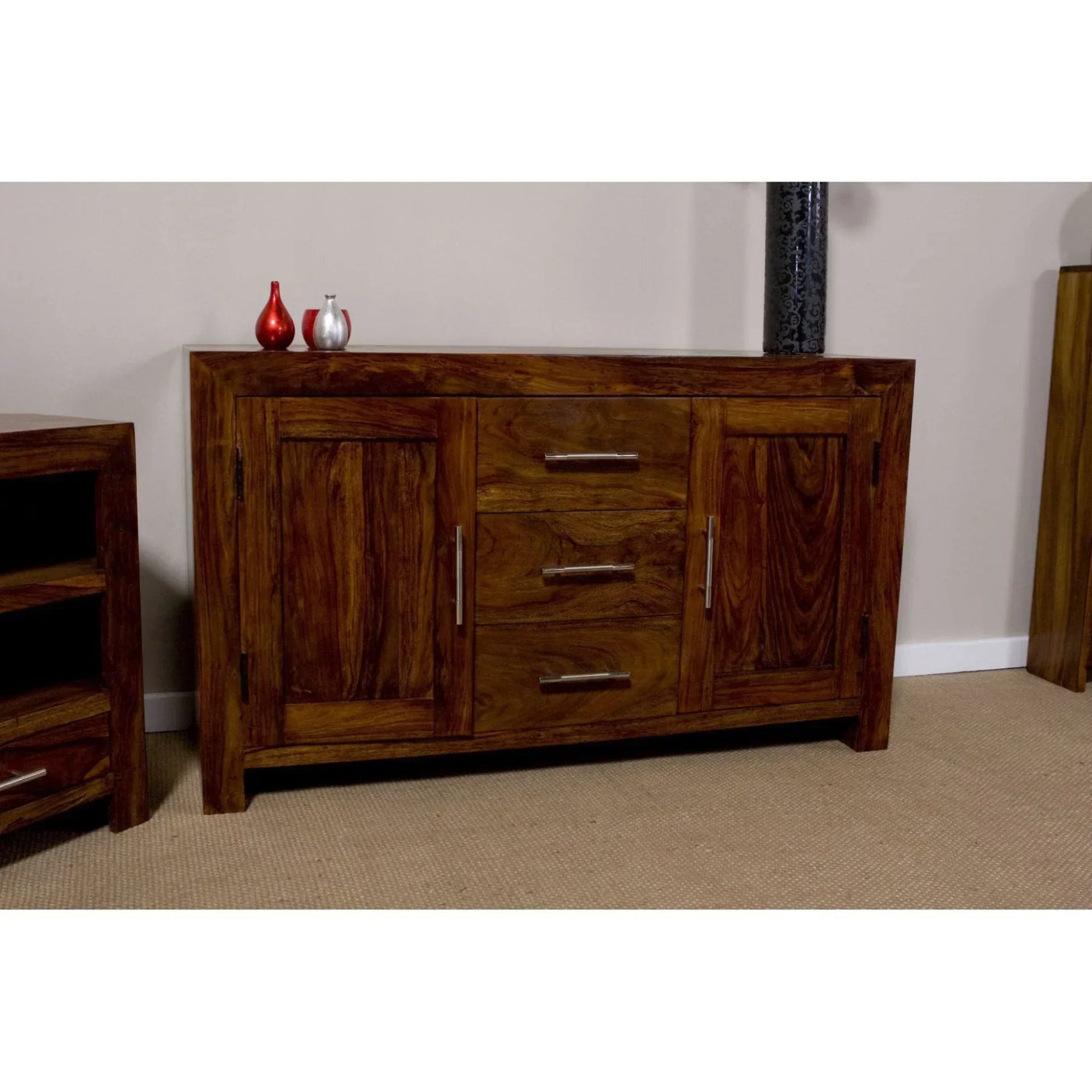 Solid wood sideboard with three drawers, two cupboards, and silver handles in living room