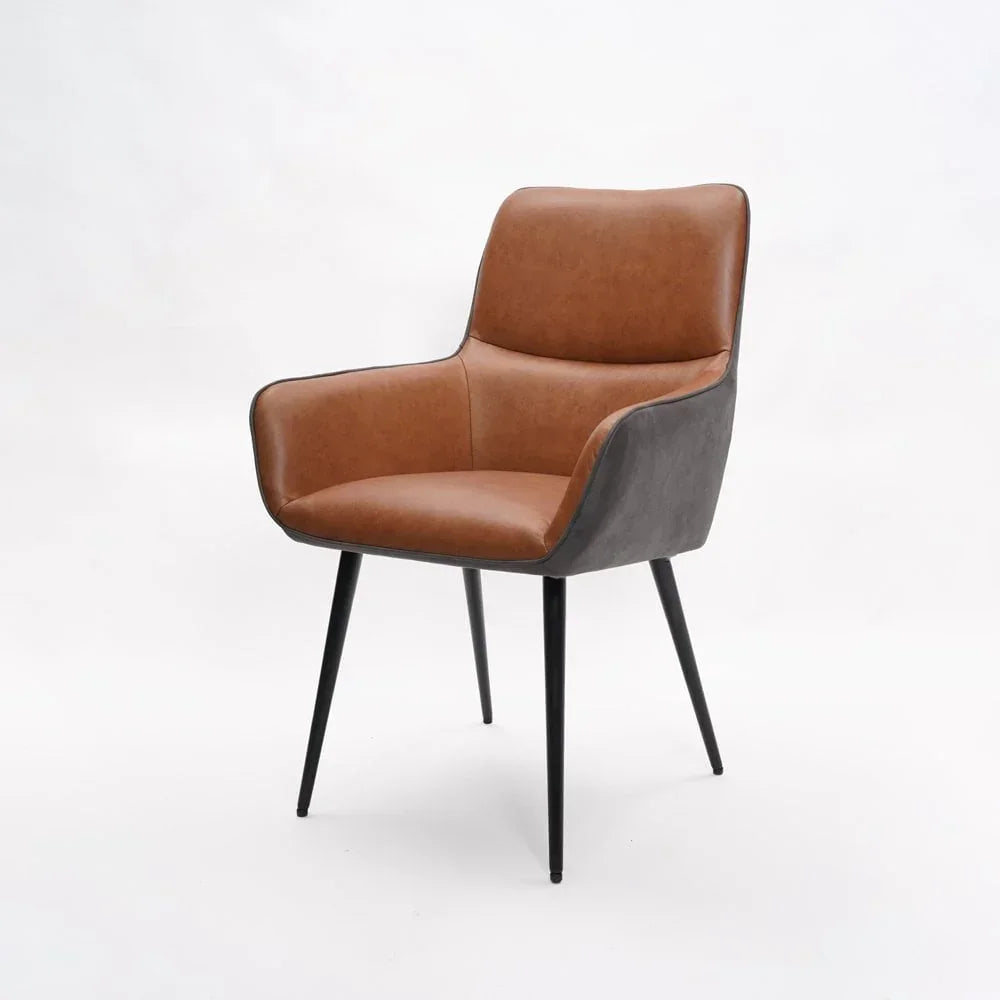Brown faux leather dining chair with black metal legs and armrests on white background