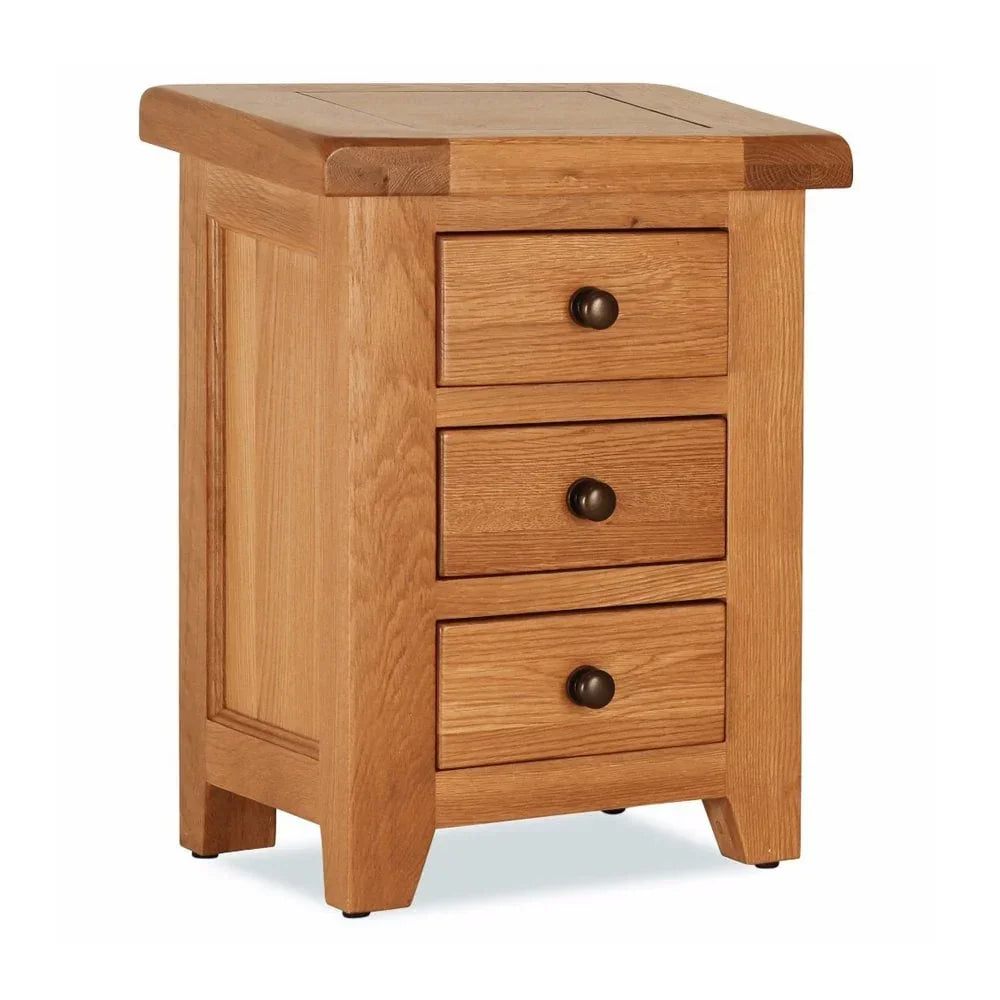 Oak bedside cabinet with three drawers and round metal handles, angled front view