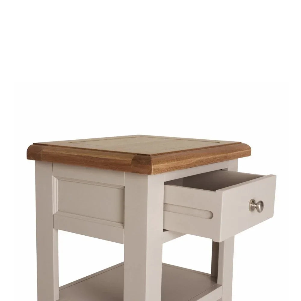 Oak and cream bedside table with drawer open and lower shelf