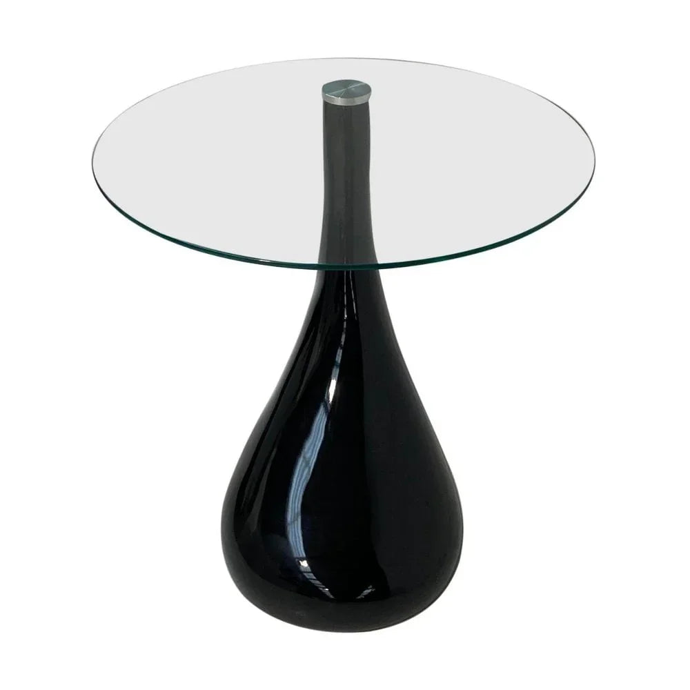 Round glass side table with black teardrop shaped base