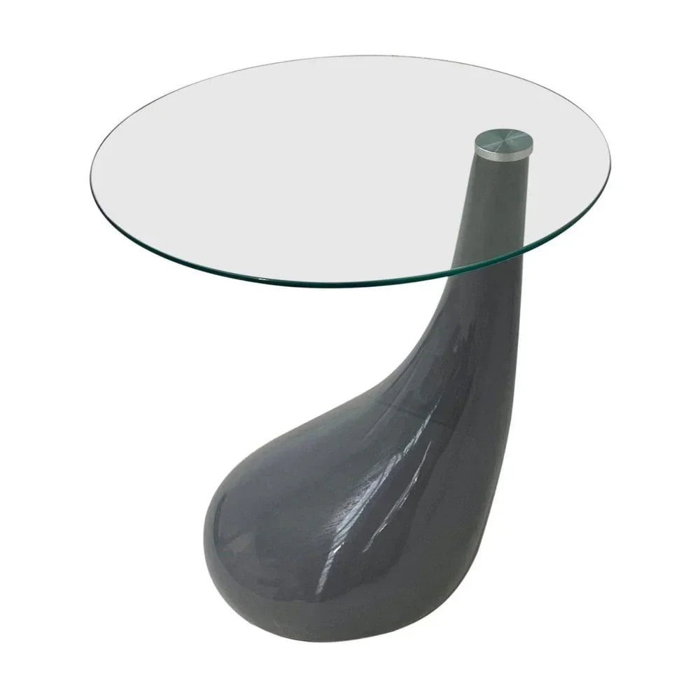 Round glass side table with sculpted grey base and modern curved design