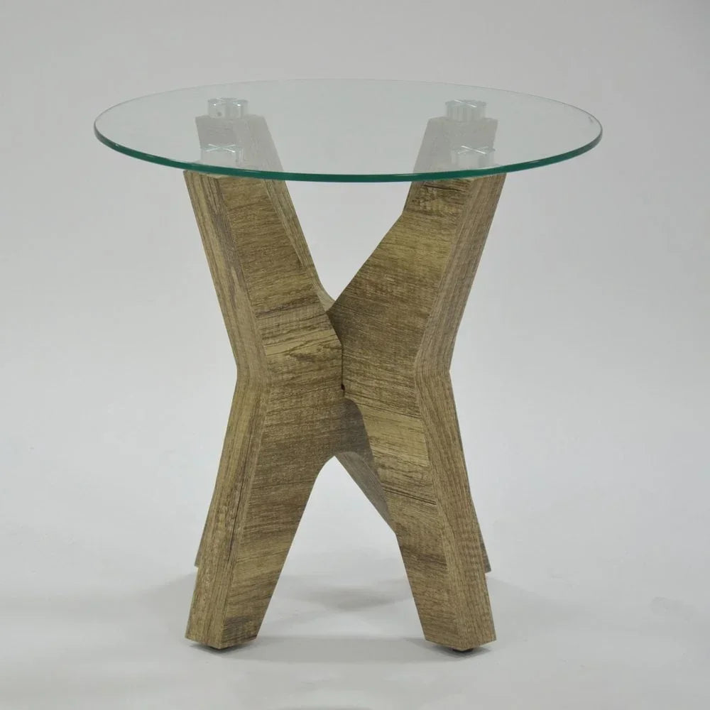 Round glass top side table with crossed wood base on white background