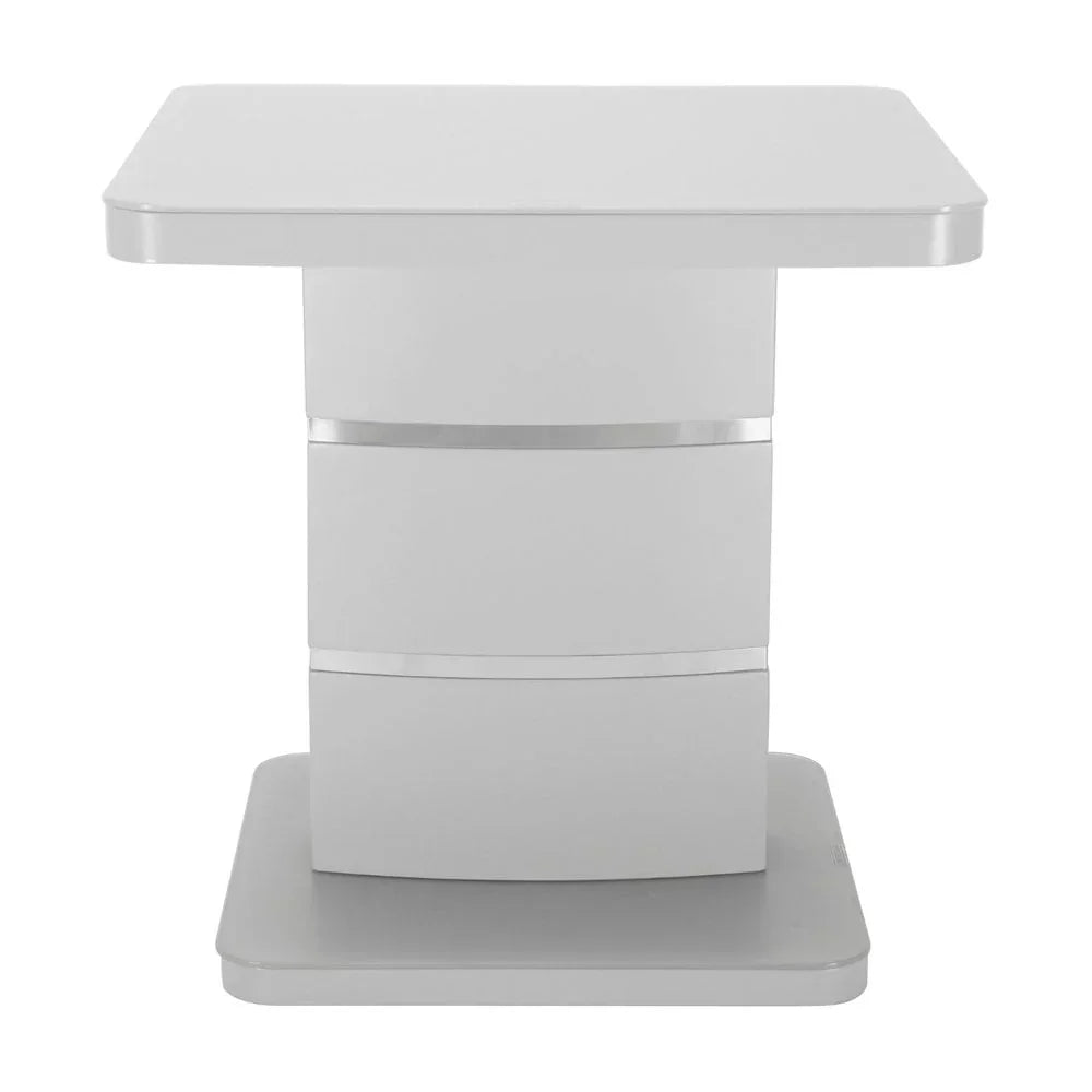 Modern white side table with chrome accents and square base, front view