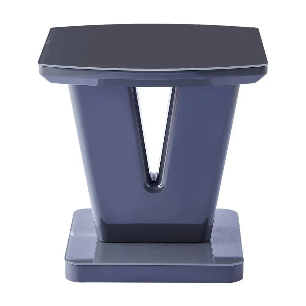 Modern navy blue side table with glossy finish and geometric base design