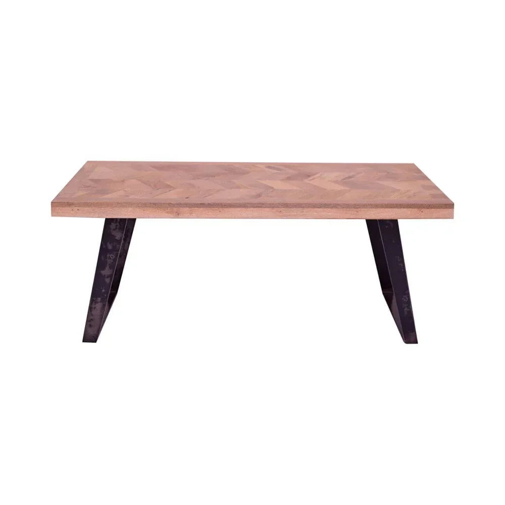 Rectangular wooden dining table with herringbone top and black metal angled legs