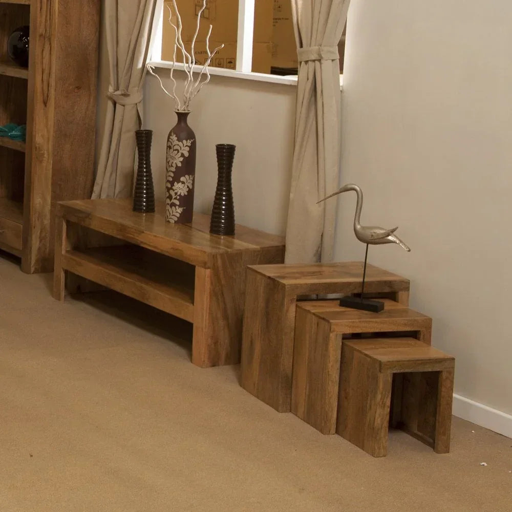 Solid wood nesting tables and hallway table with decorative vases and bird sculpture
