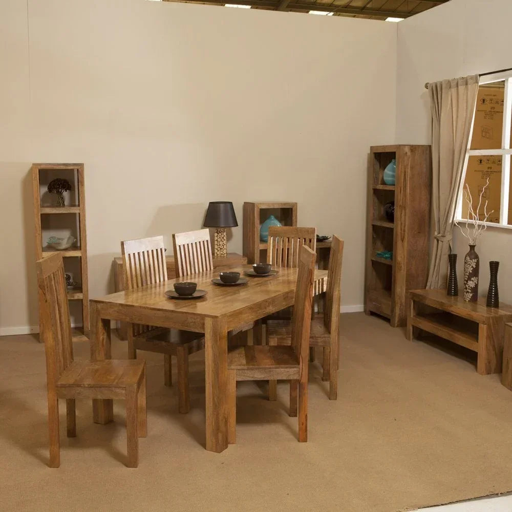 Solid wood dining table set with six chairs and matching bookshelves in a modern room