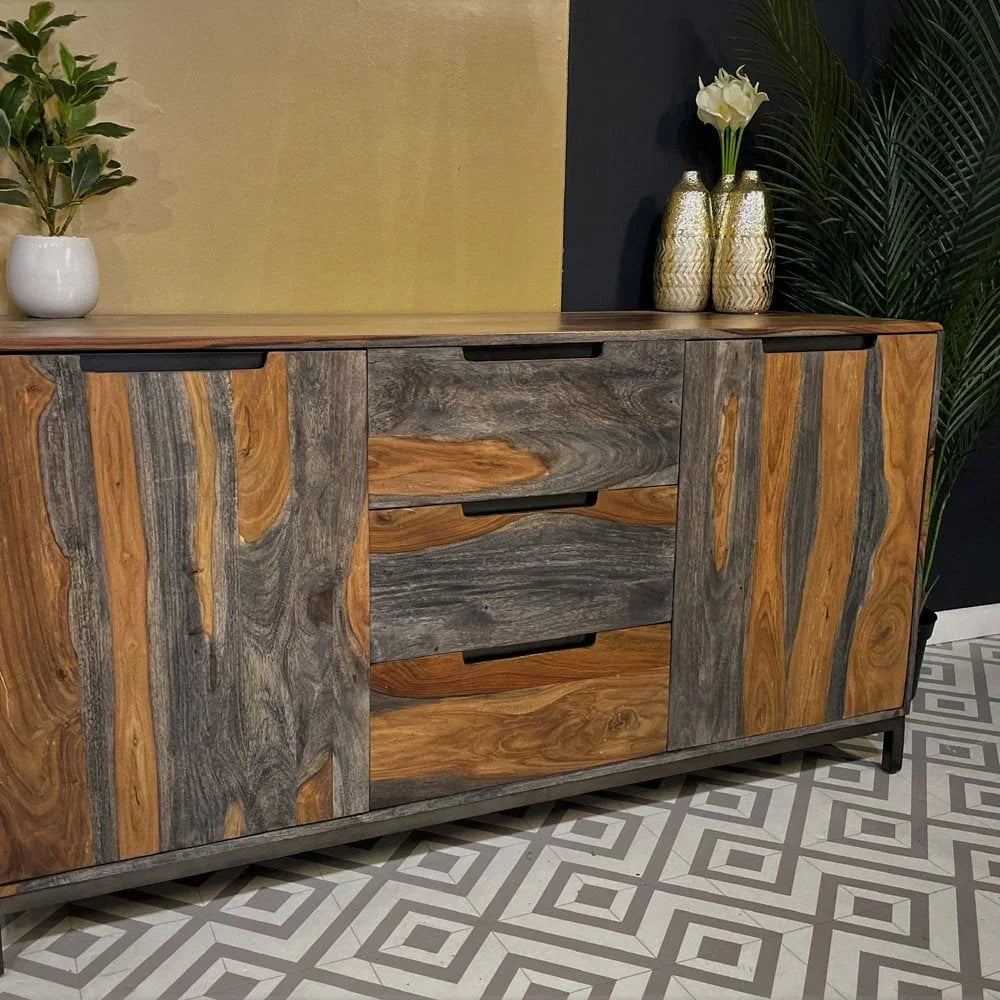 Modern sideboard with natural wood grain doors and drawers set on geometric tile floor