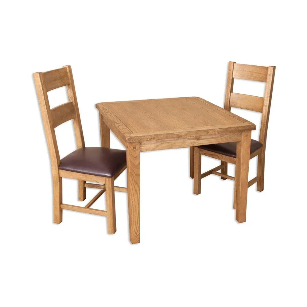 Oak dining table set with two wooden chairs and brown leather seats