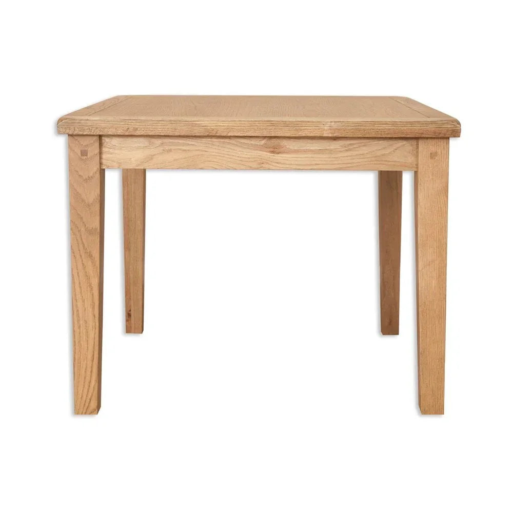Light oak dining table with rectangular top and straight legs