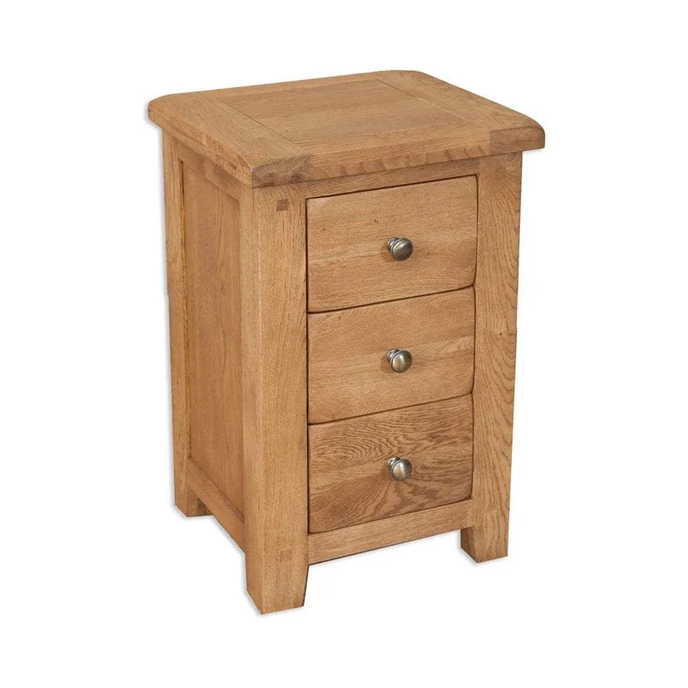 Oak bedside table with three drawers and metal handles on white background