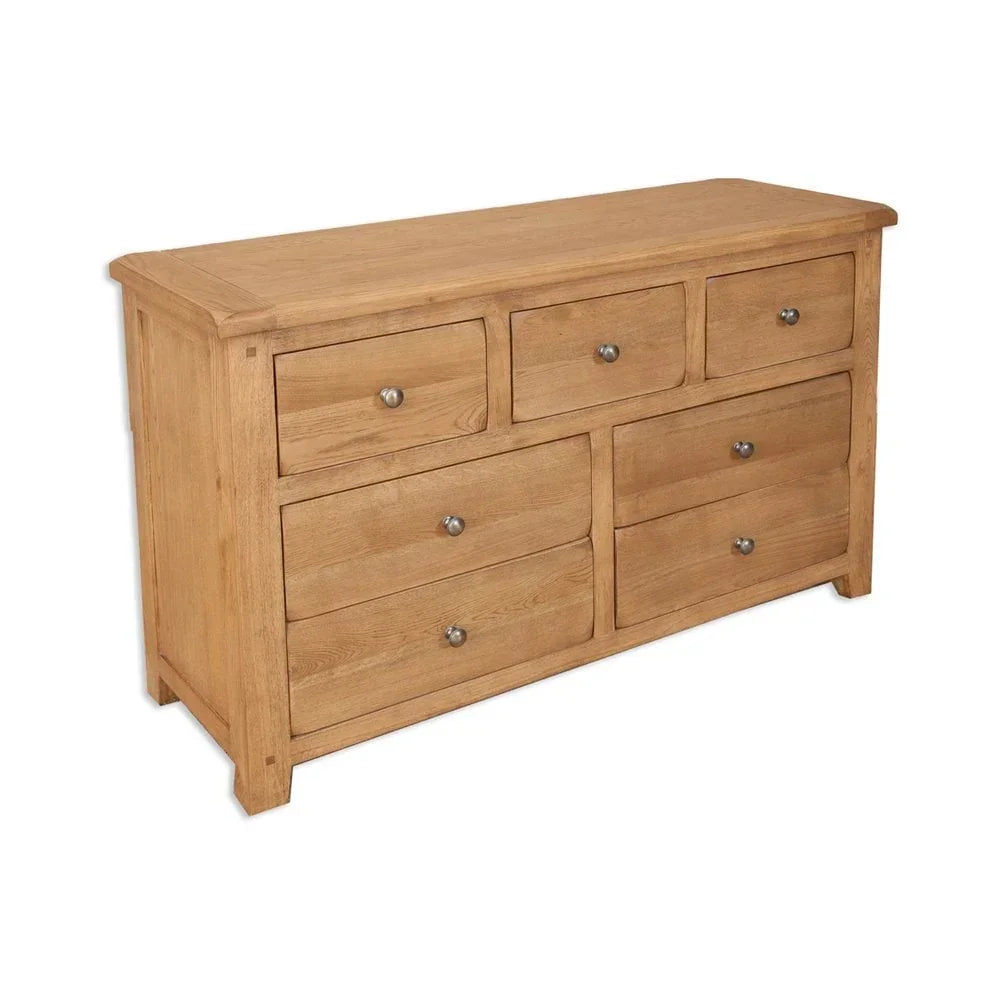 Oak wood chest of drawers with six drawers and metal handles against white background