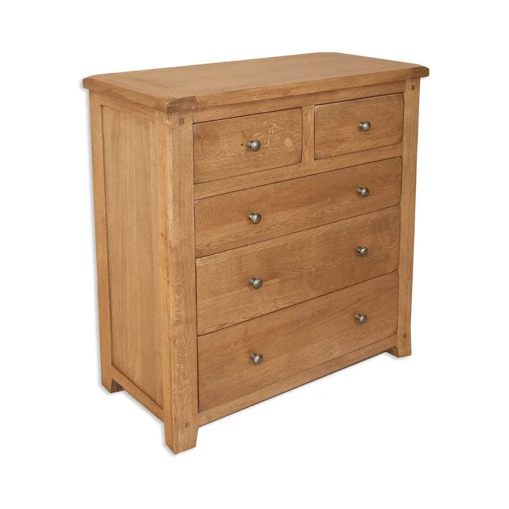 Oak chest of drawers with metal handles, five drawers, natural wood finish, angled view