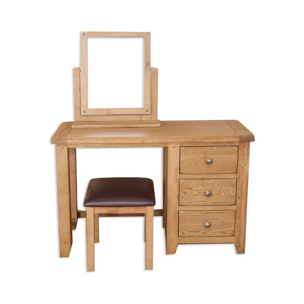 Oak dressing table set with mirror, three drawers, and padded stool