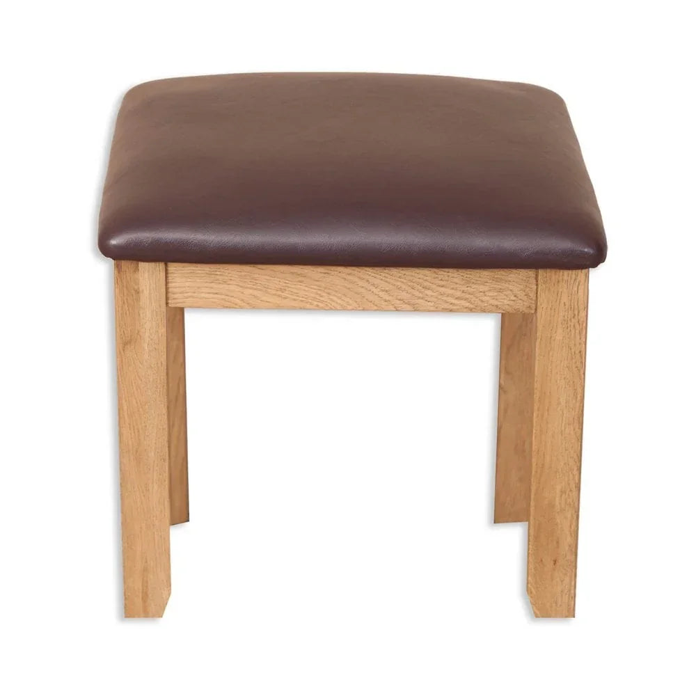 Oak stool with brown leather seat cushion, front view, simple wooden frame design