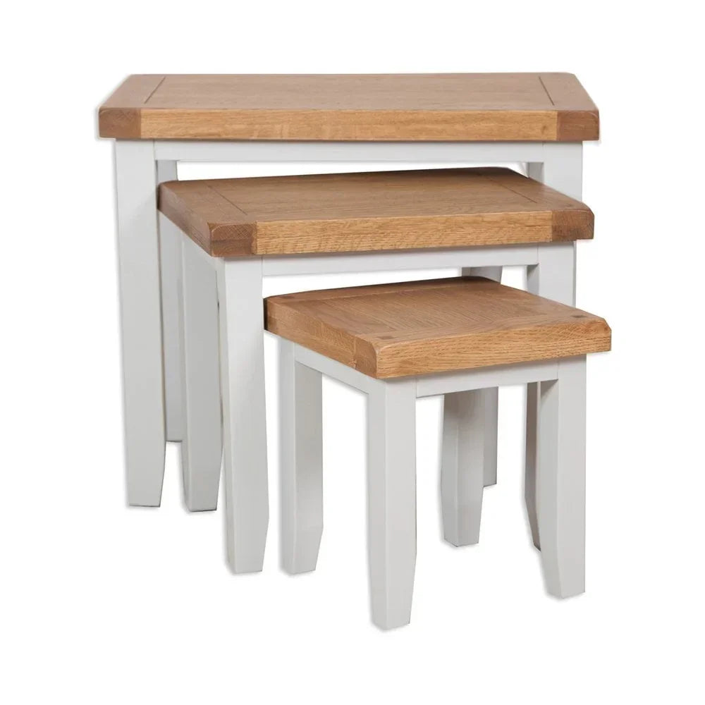 Set of three nesting tables with oak tops and white painted wooden legs