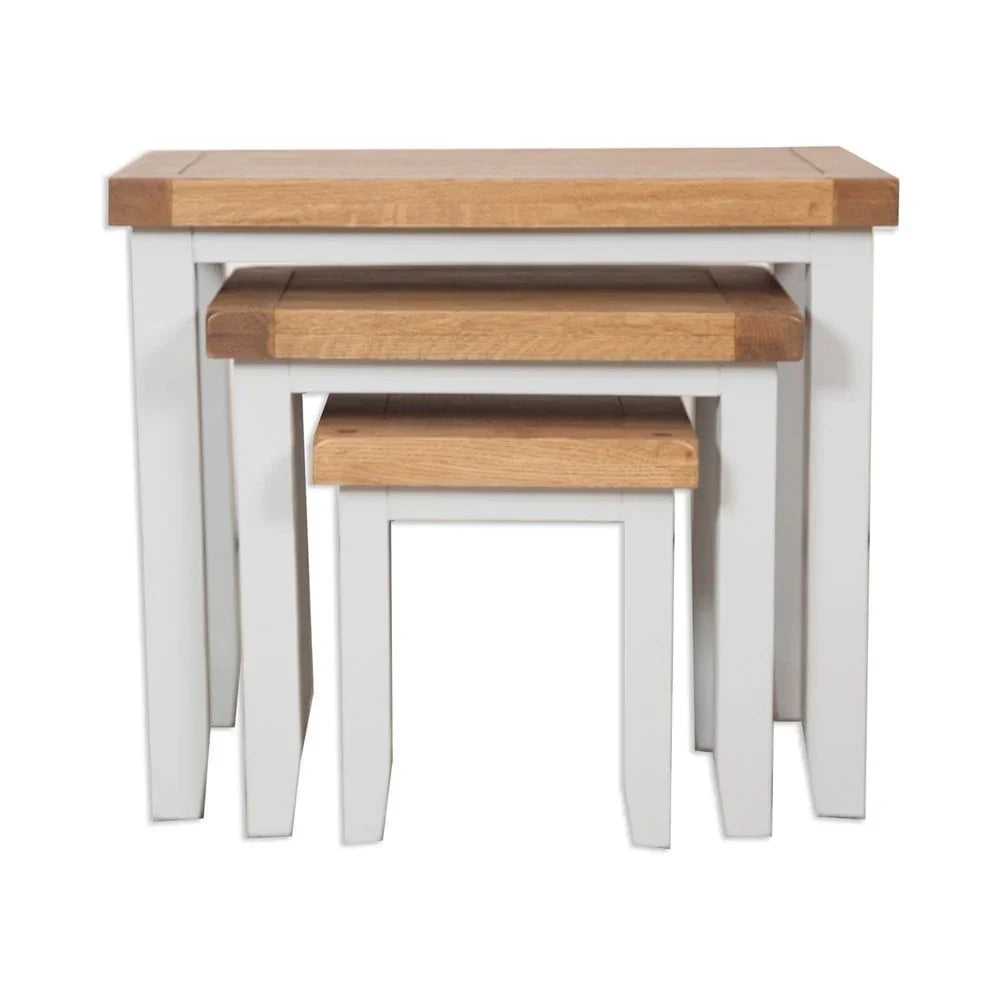 Oak and white nest of tables with wooden tops and painted legs, stacked together