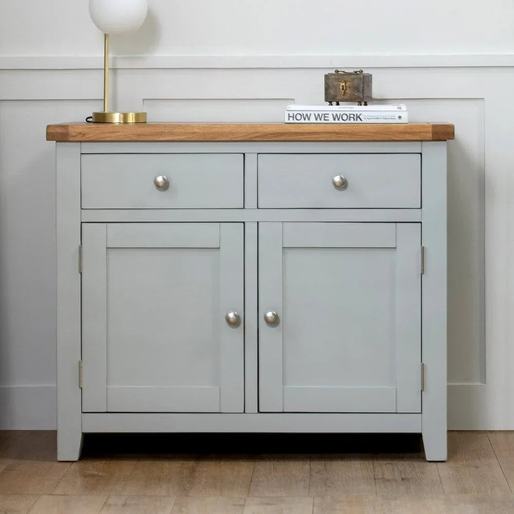 Light grey sideboard with oak top, two drawers, and two cabinets in modern room