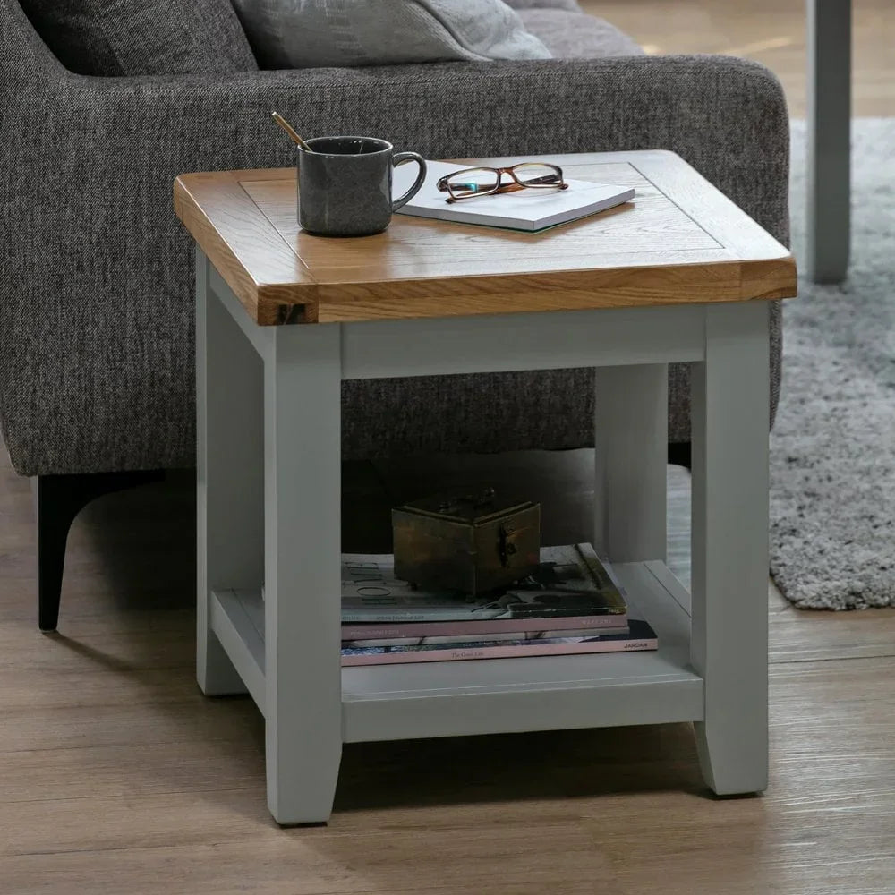 Oak and grey side table with lower shelf beside sofa, mug and glasses on top