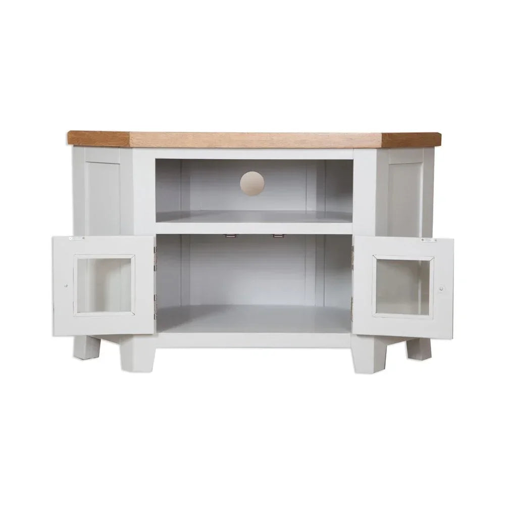 White wooden TV unit with oak top, glass cabinet doors open and central cable hole visible