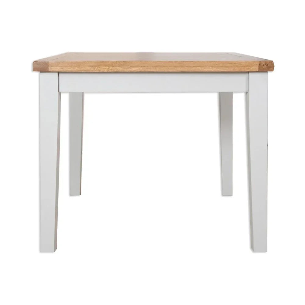 Rectangular dining table with white legs and natural wood top, front angle view