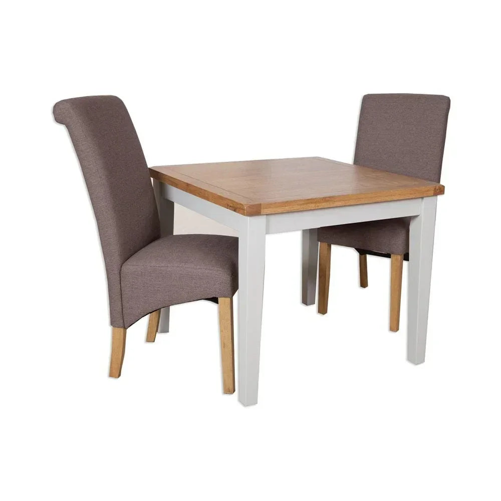 Square wooden dining table with two upholstered brown chairs and white legs