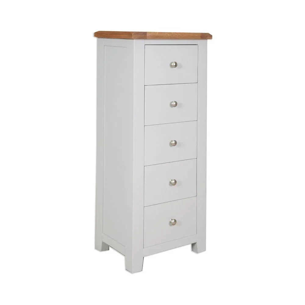 Tall white chest of drawers with five silver handles and oak top