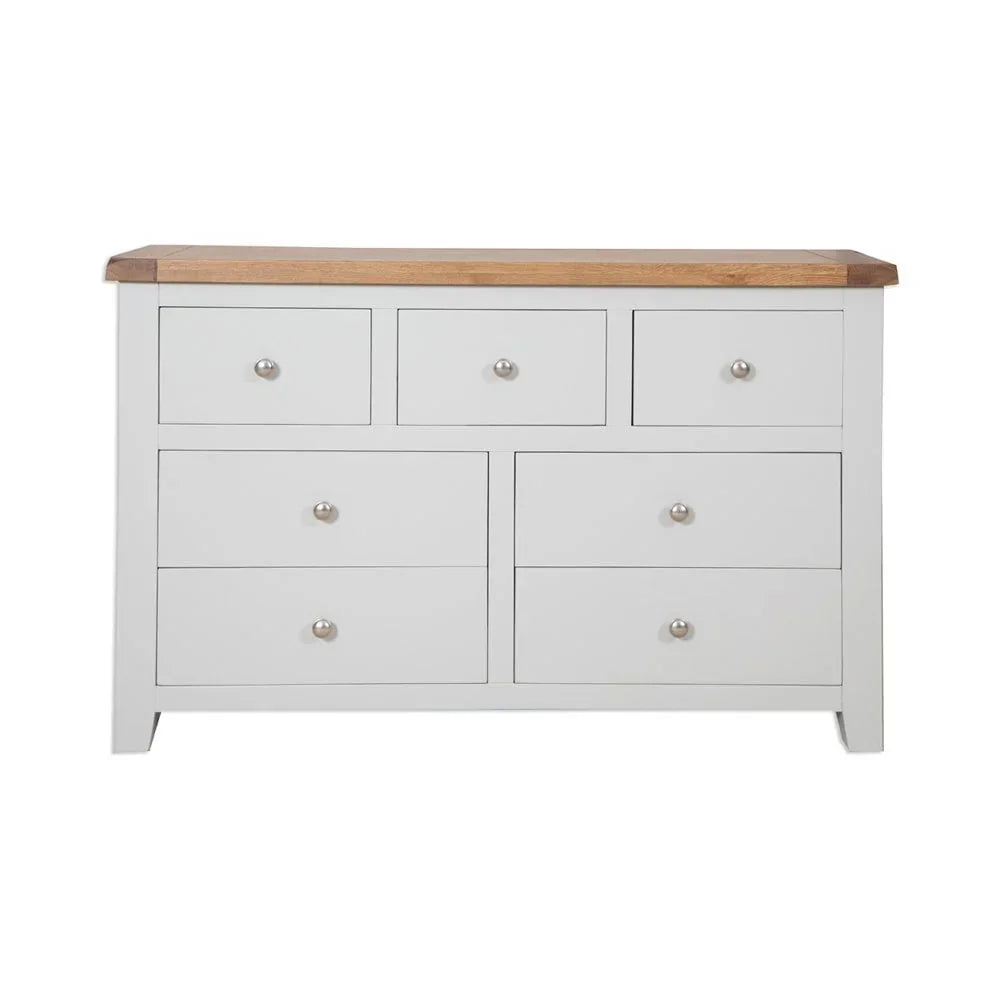 White chest of drawers with oak top and metal handles, front view