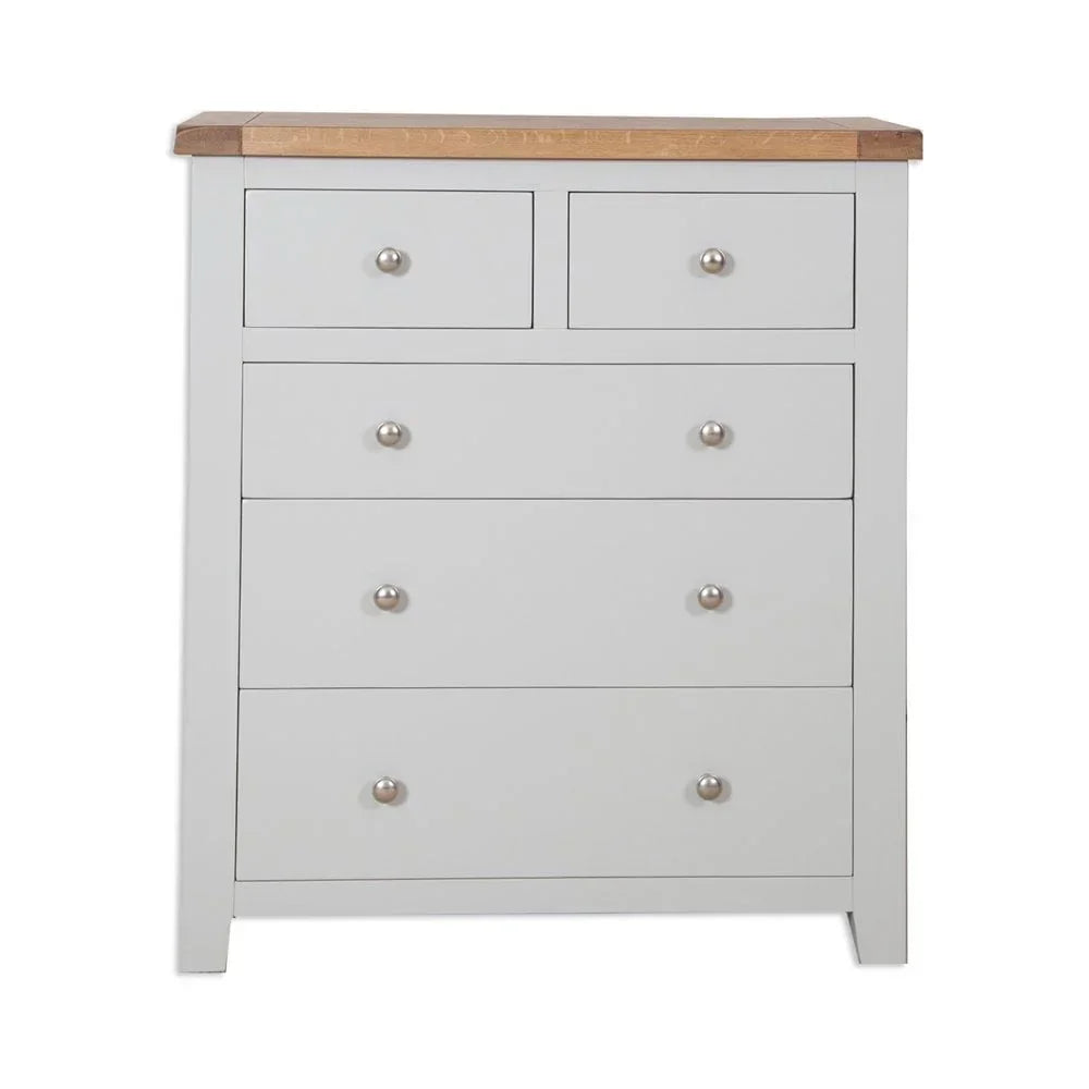 White chest of drawers with oak top and silver handles, front view