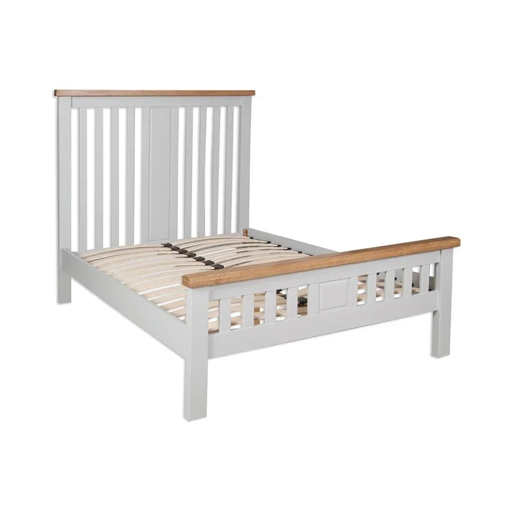 Grey wooden bed frame with slatted headboard and oak trim on white background