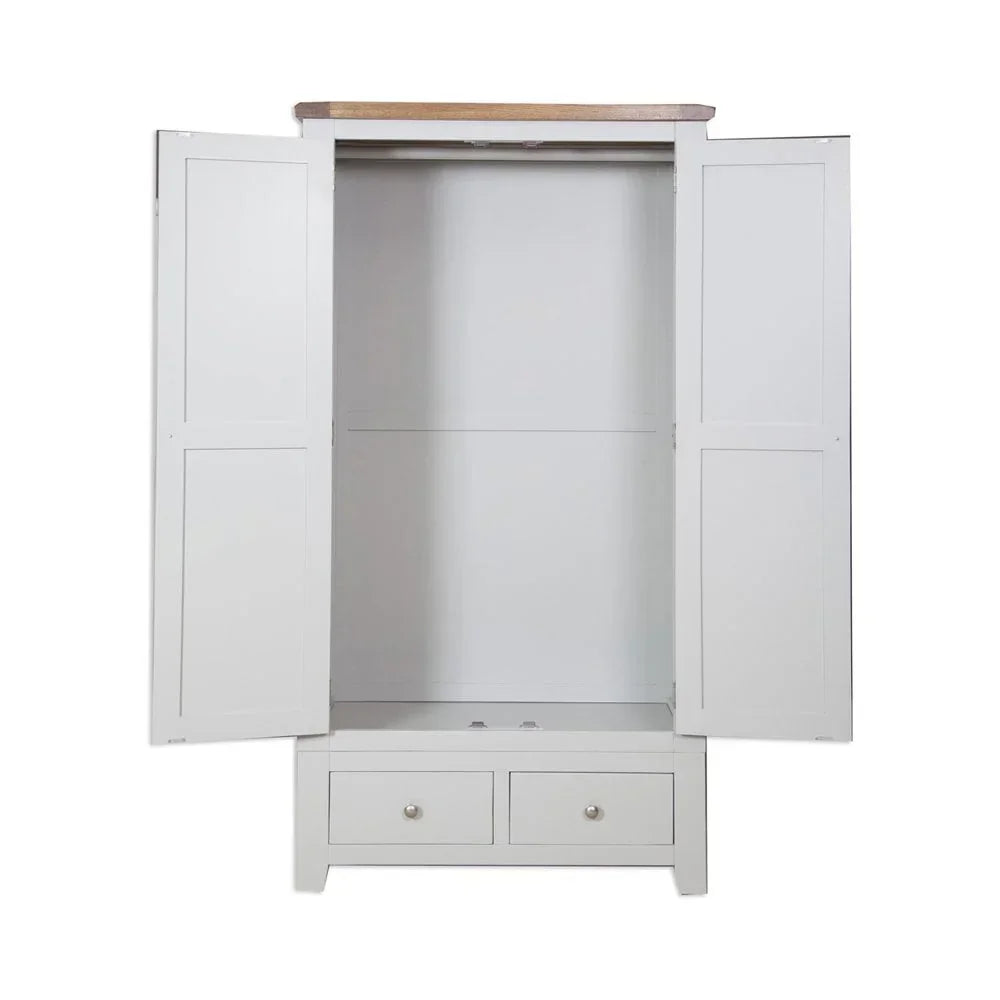 White wardrobe with open doors, wood top and two bottom drawers, front view