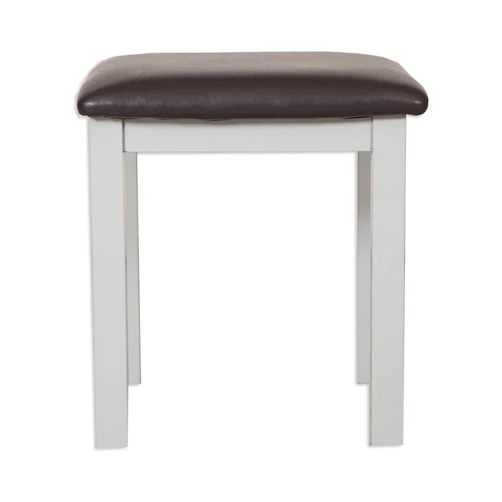 White wooden stool with brown leather seat cushion, front view