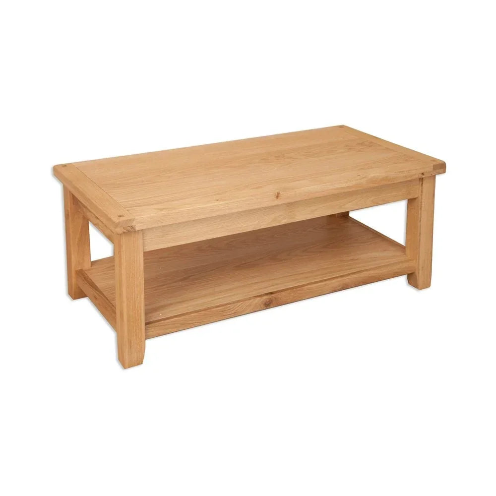 oak coffee table with lower shelf and natural wood finish on white background