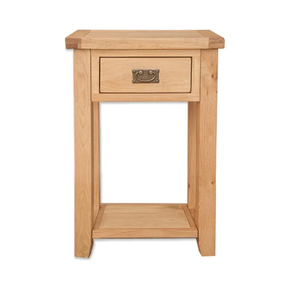 Oak bedside table with single drawer and lower shelf, brass handle, front view