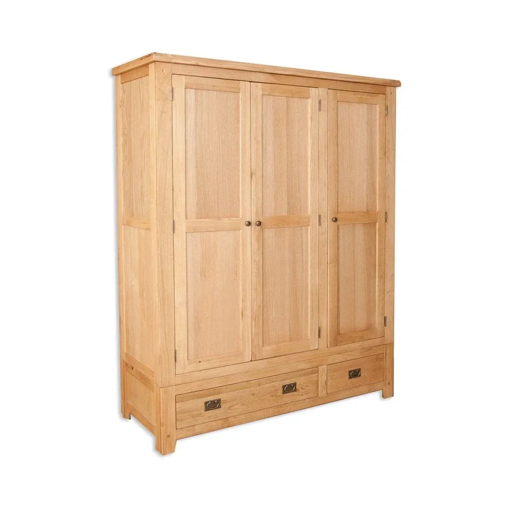 Oak wardrobe with three panel doors and two lower drawers in natural finish