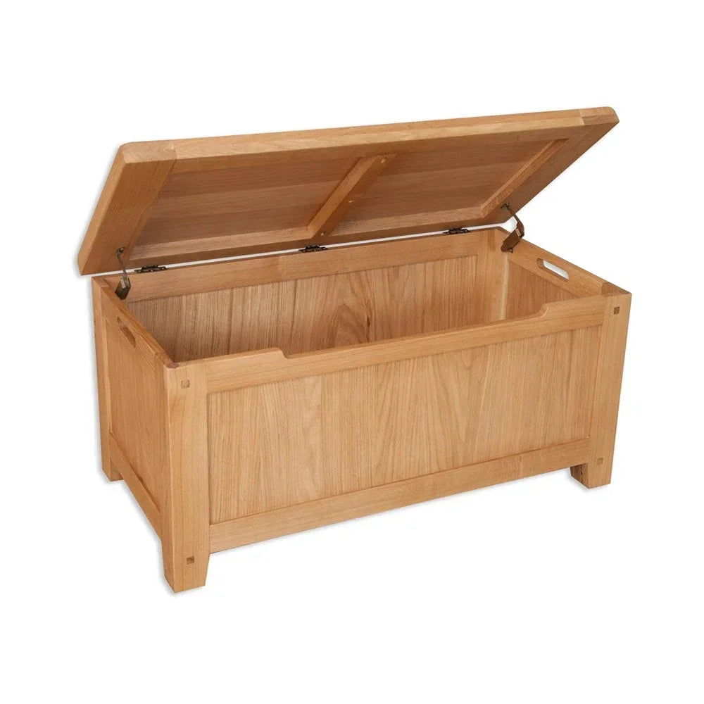 Oak wooden storage chest with hinged lid open, visible side handles and panelled design