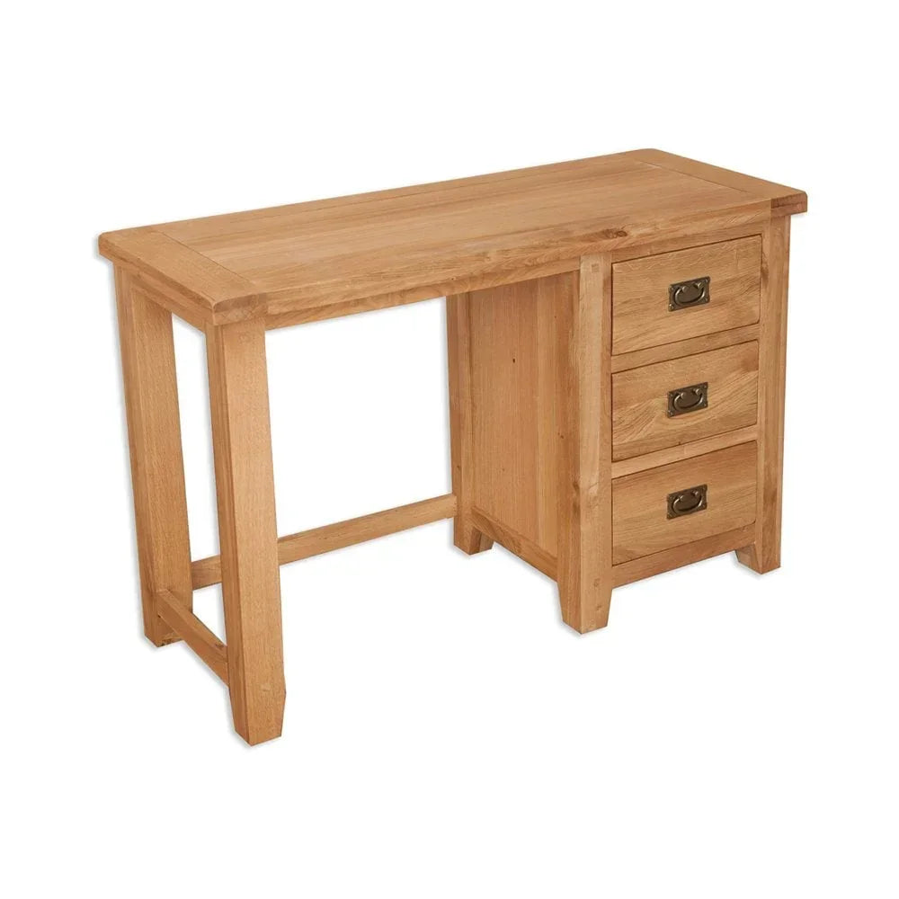 Oak desk with three side drawers and metal handles on white background