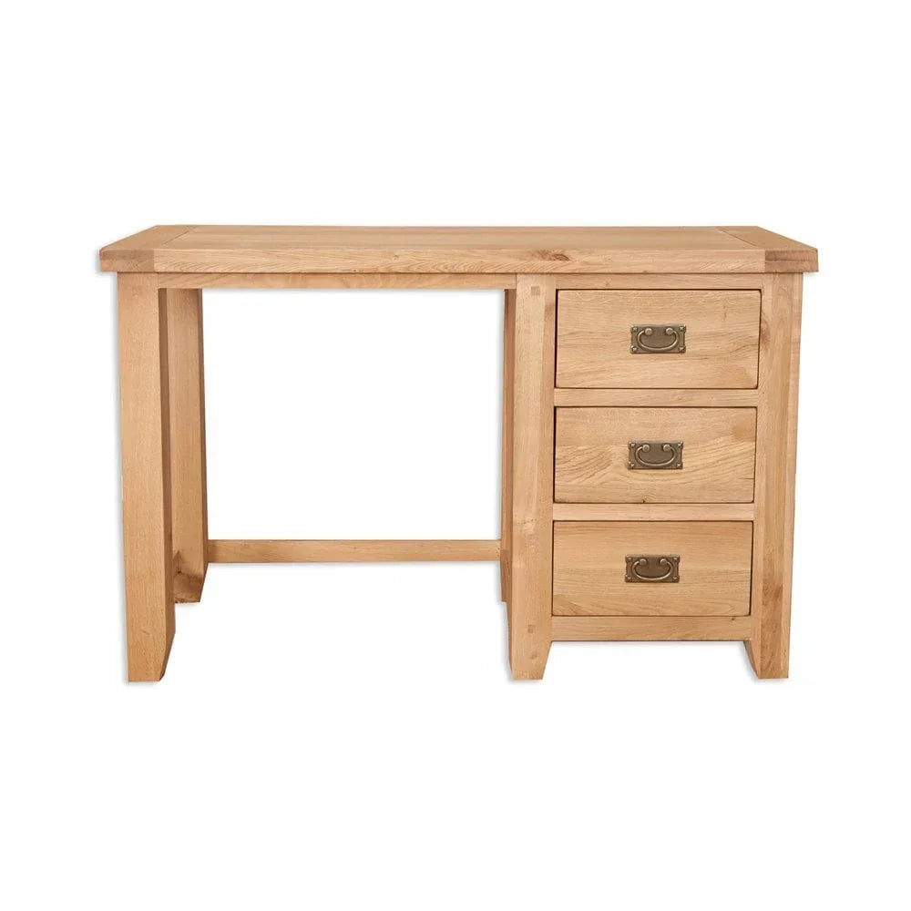 Oak desk with three drawers and metal handles, front view on white background