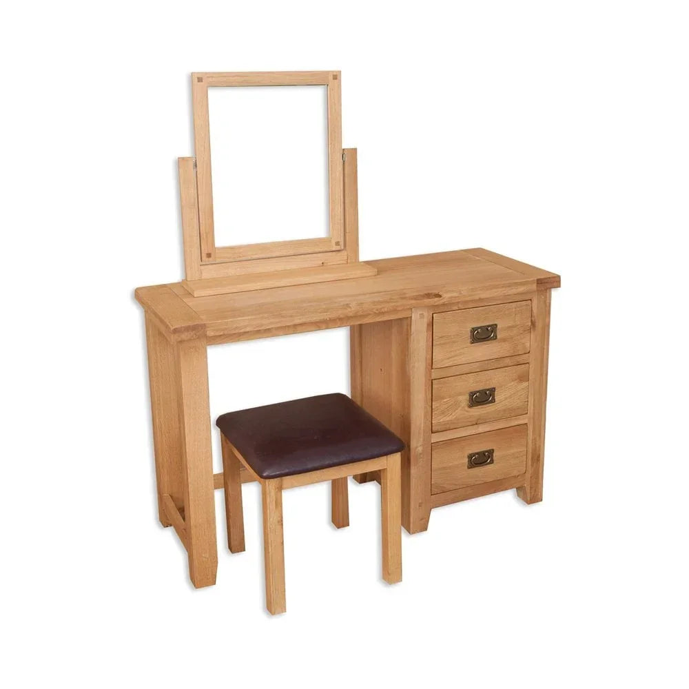 Oak dressing table with mirror, three drawers and padded stool on white background
