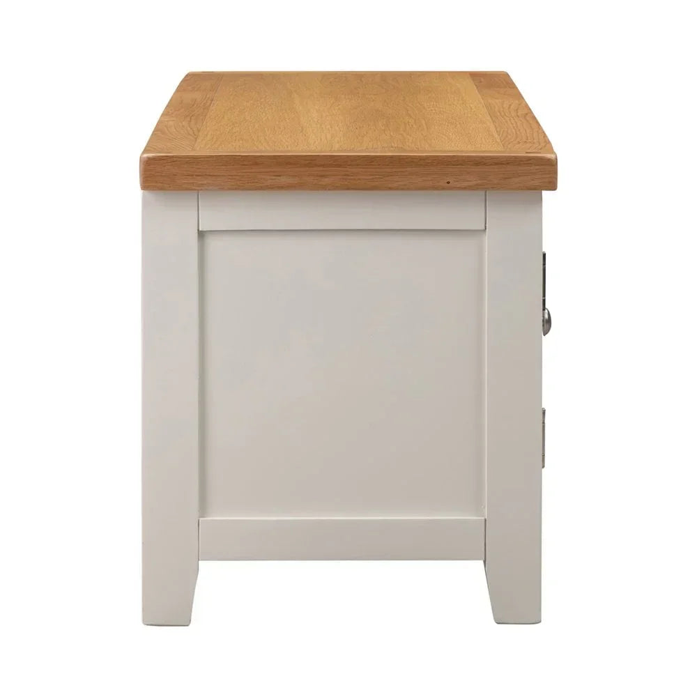 Side view of oak and painted wood side table with square legs and smooth finish