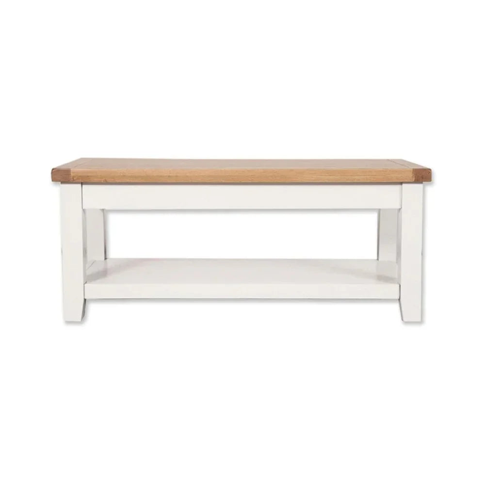 Rectangular coffee table with oak top and white wooden base with lower shelf
